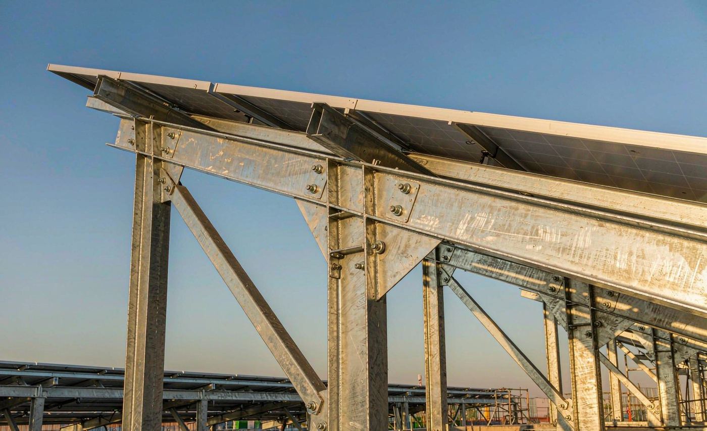 Galvanized steel structure node connection with bolted plates at a solar mounting construction site